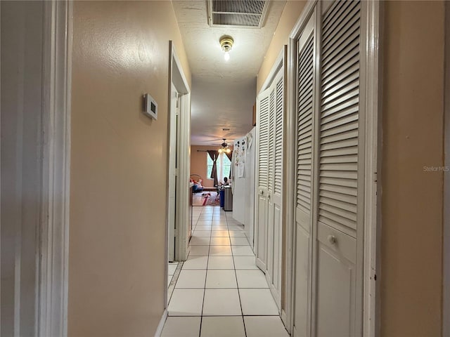 831 Fletcher Rd SE, Palm Bay, FL 32909 - hallway featuring light tile patterned flooring