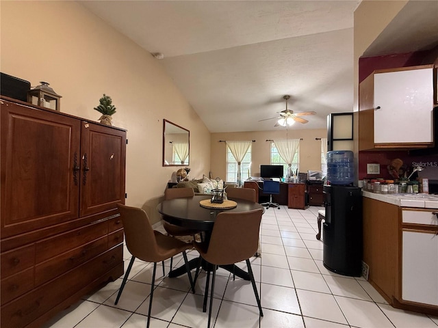 831 Fletcher Rd SE, Palm Bay, FL 32909 - dining space with an office area, lofted ceiling, ceiling fan, and light tile patterned floors
