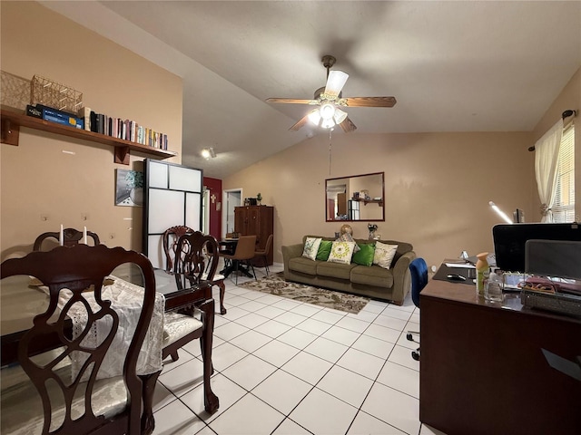 831 Fletcher Rd SE, Palm Bay, FL 32909 - dining room featuring a ceiling fan, vaulted ceiling, and light tile patterned flooring