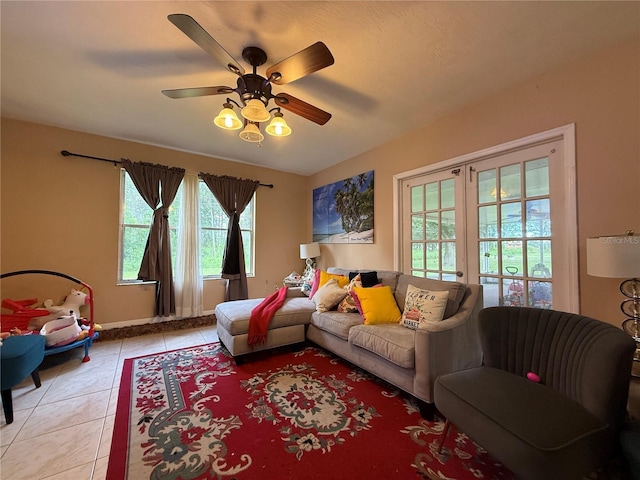 831 Fletcher Rd SE, Palm Bay, FL 32909 - living area with light tile patterned floors and a ceiling fan