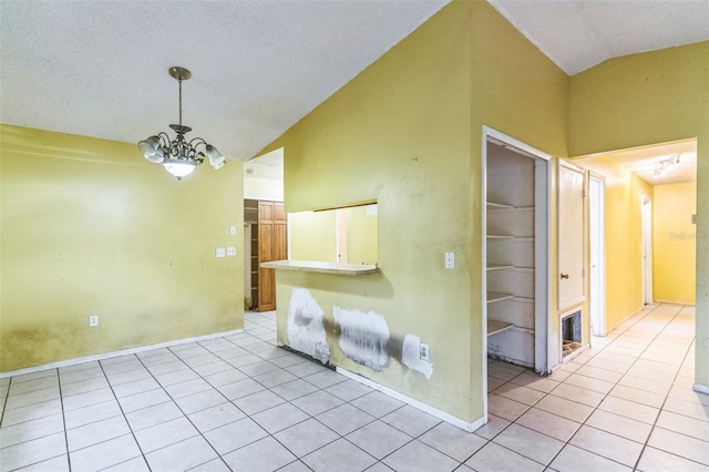 1212 N Hudson St, Orlando, FL 32808 - empty room featuring a chandelier, light tile patterned floors, and high vaulted ceiling