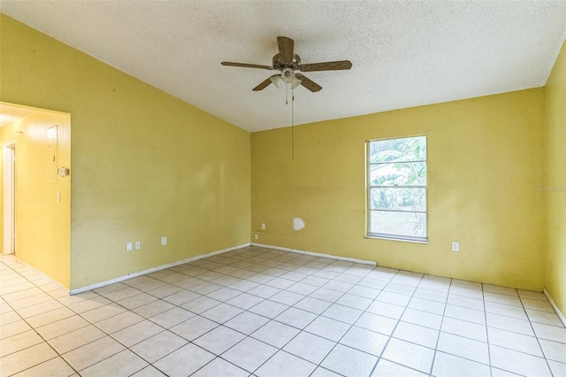 1212 N Hudson St, Orlando, FL 32808 - empty room with ceiling fan, a textured ceiling, light tile patterned floors, and vaulted ceiling