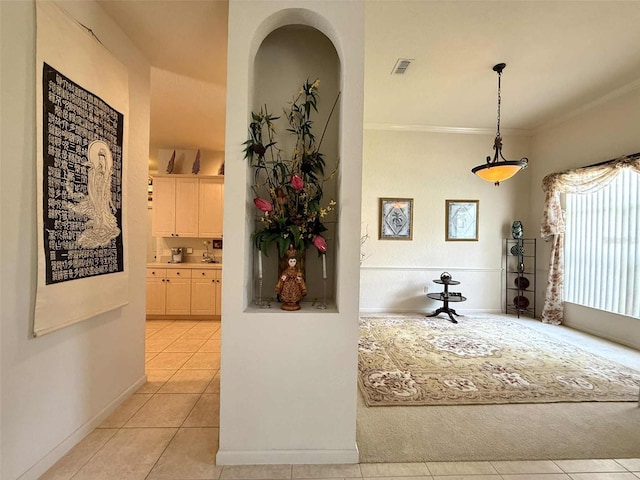3539 Maple Ridge Loop, Kissimmee, FL 34741 - corridor featuring light tile patterned floors and ornamental molding