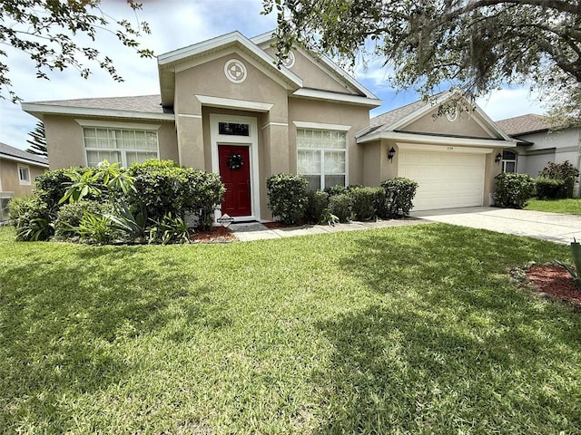 3539 Maple Ridge Loop, Kissimmee, FL 34741 - ranch-style home featuring stucco siding, an attached garage, driveway, and a front yard