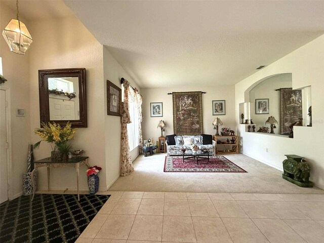 3539 Maple Ridge Loop, Kissimmee, FL 34741 - carpeted living area with tile patterned flooring and baseboards
