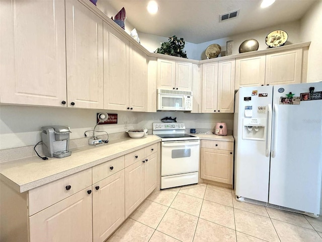 3539 Maple Ridge Loop, Kissimmee, FL 34741 - kitchen featuring white appliances, light countertops, and light tile patterned floors