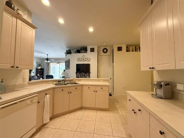 3539 Maple Ridge Loop, Kissimmee, FL 34741 - kitchen with white dishwasher, light countertops, a peninsula, light tile patterned flooring, and recessed lighting