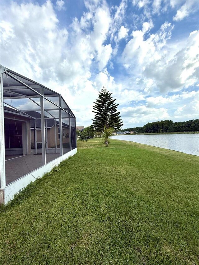 3539 Maple Ridge Loop, Kissimmee, FL 34741 - view of grassy yard featuring a water view and a lanai