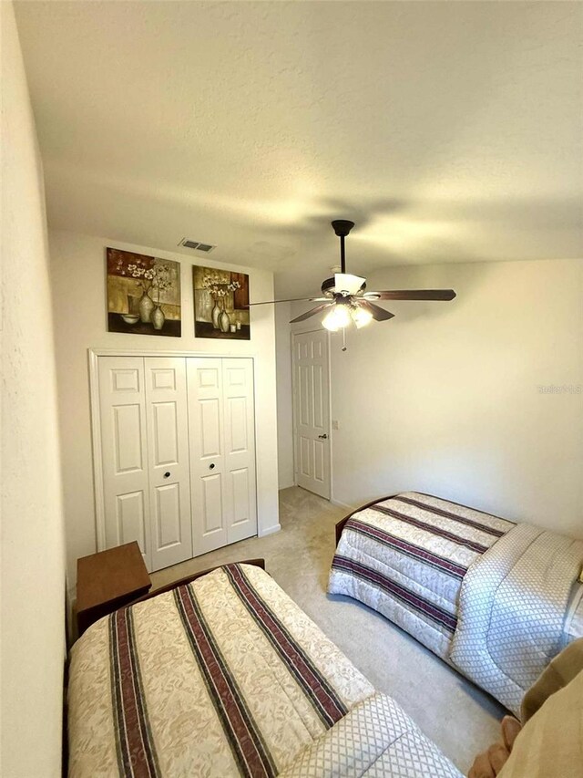 3539 Maple Ridge Loop, Kissimmee, FL 34741 - bedroom with light colored carpet, ceiling fan, and a closet