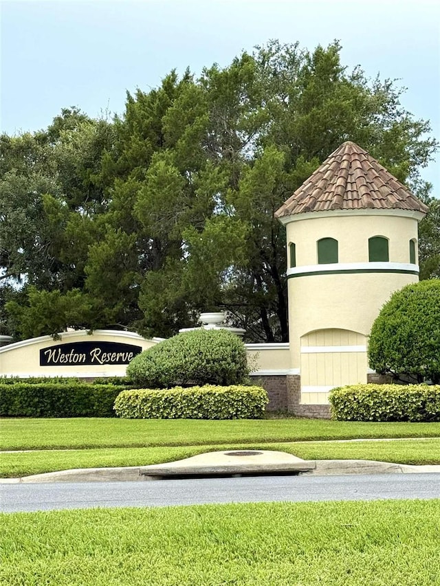 3539 Maple Ridge Loop, Kissimmee, FL 34741 - community / neighborhood sign featuring a yard