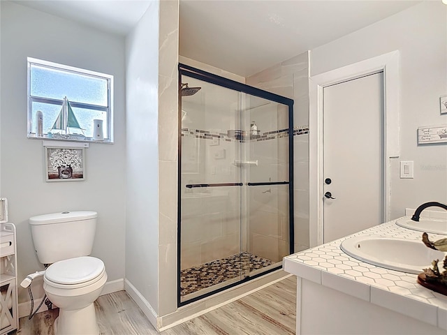 1475 Mars St, Merritt Island, FL 32953 - full bathroom with vanity, a stall shower, and wood finished floors