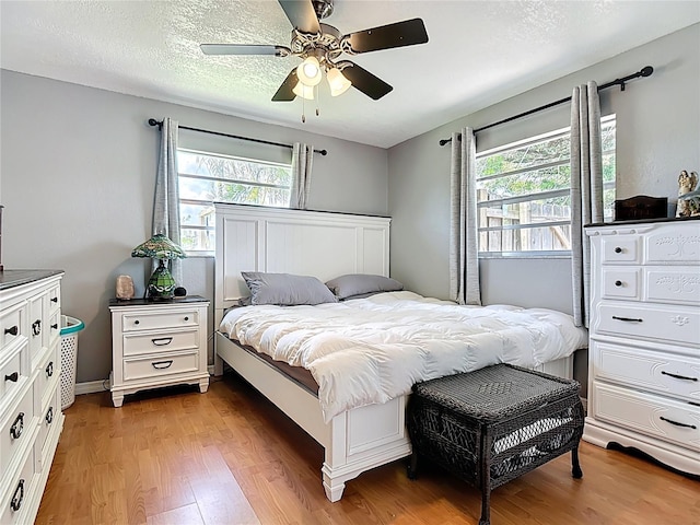 1475 Mars St, Merritt Island, FL 32953 - bedroom featuring multiple windows, light wood-style floors, and ceiling fan