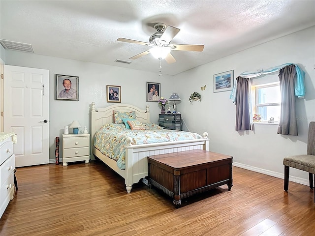 1475 Mars St, Merritt Island, FL 32953 - bedroom featuring wood finished floors, ceiling fan, and a textured ceiling