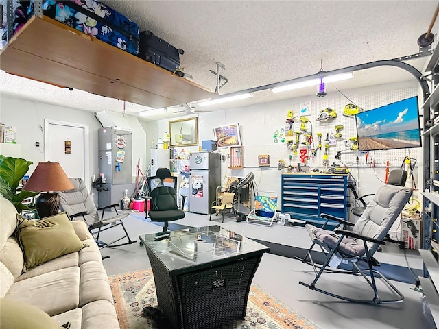 1475 Mars St, Merritt Island, FL 32953 - living room with concrete floors, water heater, and a textured ceiling