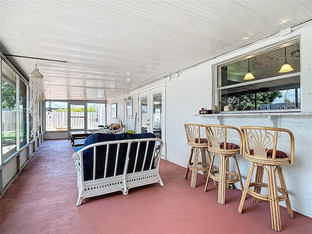 1475 Mars St, Merritt Island, FL 32953 - sunroom with french doors, a textured wall, and a bar