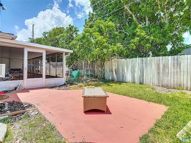 1475 Mars St, Merritt Island, FL 32953 - fenced backyard featuring a patio and a sunroom