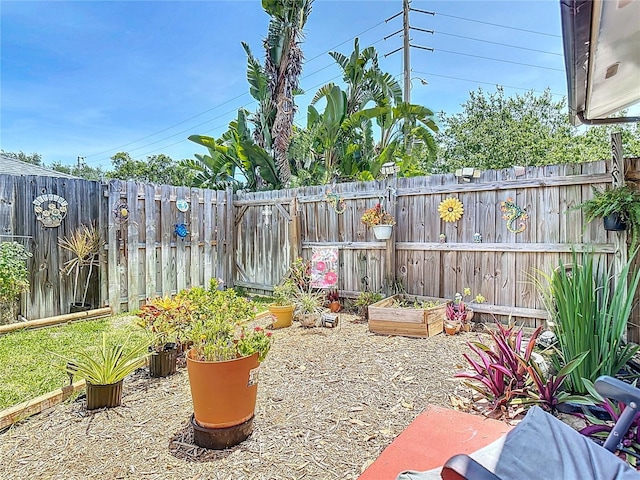 1475 Mars St, Merritt Island, FL 32953 - view of yard featuring a garden