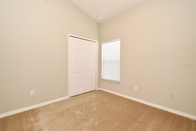 2131 Kaylas Ct, Orlando, FL 32817 - spare room with light carpet and high vaulted ceiling