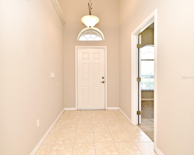 2131 Kaylas Ct, Orlando, FL 32817 - foyer featuring light tile patterned floors and baseboards
