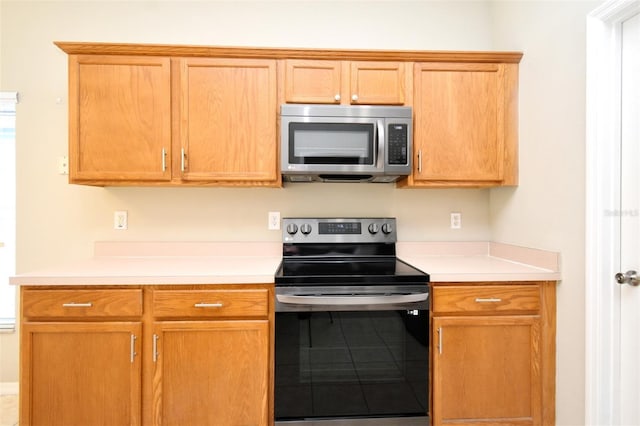 2131 Kaylas Ct, Orlando, FL 32817 - kitchen with appliances with stainless steel finishes and light countertops