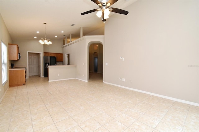 2131 Kaylas Ct, Orlando, FL 32817 - unfurnished living room featuring arched walkways, lofted ceiling, ceiling fan, light tile patterned floors, and recessed lighting