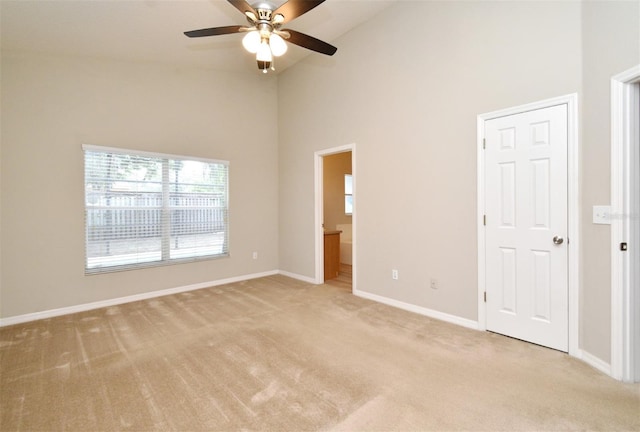 2131 Kaylas Ct, Orlando, FL 32817 - unfurnished bedroom with light carpet, high vaulted ceiling, ensuite bath, and ceiling fan