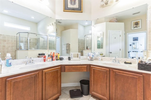 20074 Heritage Point Dr, Tampa, FL 33647 - bathroom featuring double vanity, tile patterned floors, and a shower stall