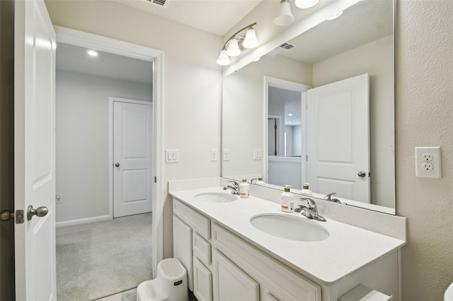 2056 Airedale Way, Lake Alfred, FL 33850 - bathroom featuring double vanity and baseboards