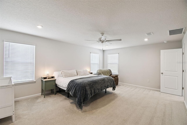 2056 Airedale Way, Lake Alfred, FL 33850 - bedroom with light colored carpet, a textured ceiling, a ceiling fan, and recessed lighting