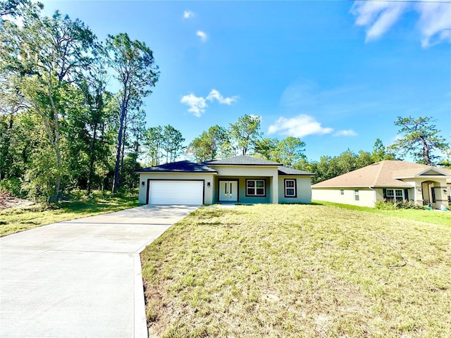 2176 W Galaxy Ln, Citrus Springs, FL 34434 - view of front of house featuring concrete driveway, a garage, a front yard, and stucco siding