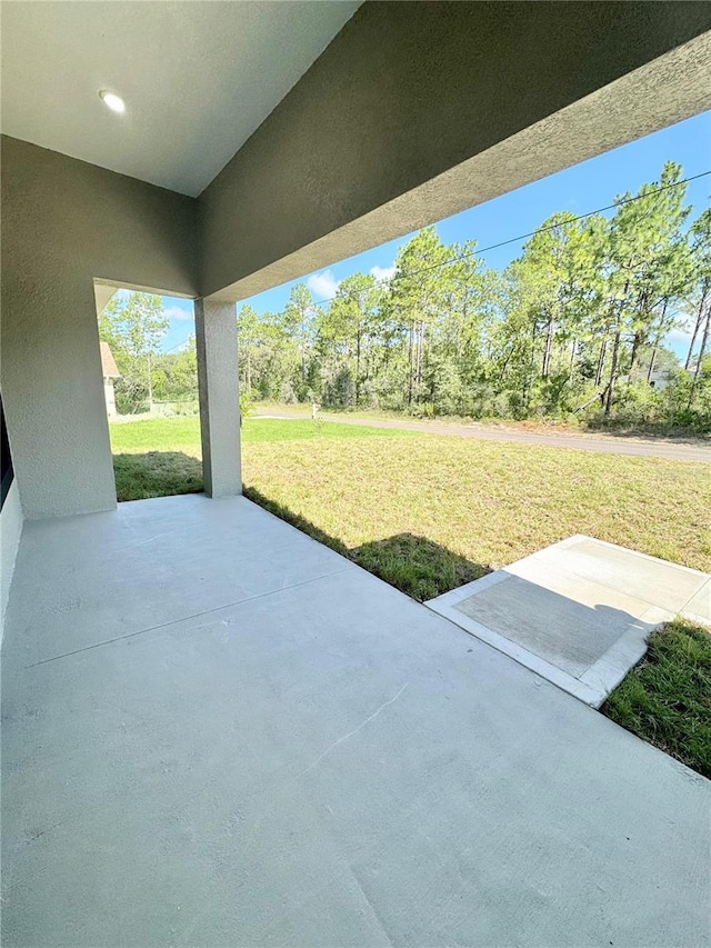 2176 W Galaxy Ln, Citrus Springs, FL 34434 - view of patio with view of wooded area