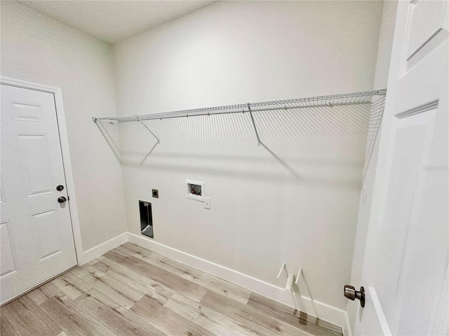 2176 W Galaxy Ln, Citrus Springs, FL 34434 - laundry area featuring light wood-style floors, electric dryer hookup, and washer hookup