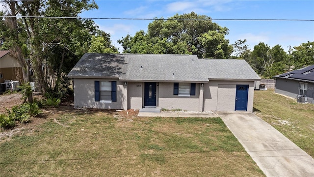 1066 Swanson Dr, Deltona, FL 32738 - view of front facade featuring stucco siding, a front lawn, concrete driveway, and roof with shingles