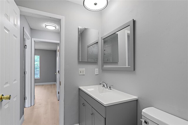 1066 Swanson Dr, Deltona, FL 32738 - half bathroom with vanity and wood finished floors