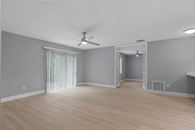 1066 Swanson Dr, Deltona, FL 32738 - unfurnished room with ceiling fan, light wood finished floors, and a textured ceiling