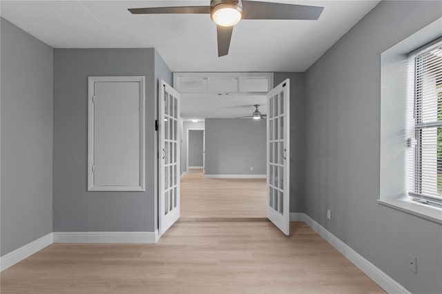 1066 Swanson Dr, Deltona, FL 32738 - unfurnished room with french doors, a ceiling fan, light wood-type flooring, and plenty of natural light