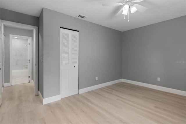 1066 Swanson Dr, Deltona, FL 32738 - unfurnished bedroom featuring light wood finished floors, a closet, and ceiling fan