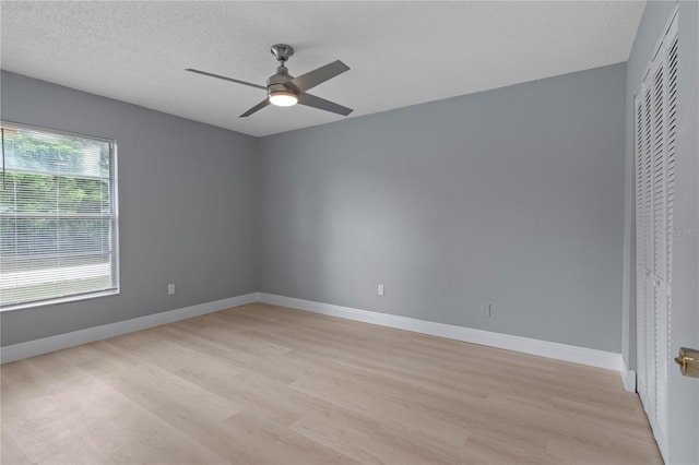 1066 Swanson Dr, Deltona, FL 32738 - spare room with light wood-style flooring, ceiling fan, and a textured ceiling
