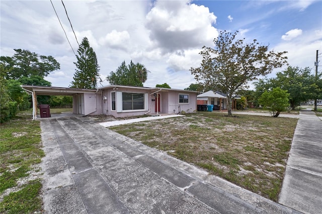 535 Romano Ave, Orlando, FL 32807 - ranch-style home featuring an attached carport and driveway