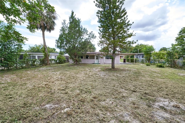 535 Romano Ave, Orlando, FL 32807 - view of yard featuring a carport