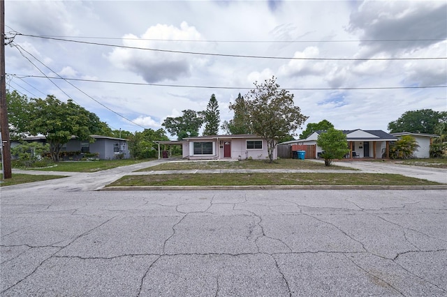 535 Romano Ave, Orlando, FL 32807 - ranch-style home featuring asphalt driveway and a front lawn