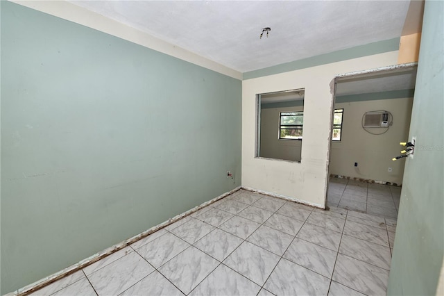 535 Romano Ave, Orlando, FL 32807 - unfurnished room featuring tile patterned flooring and a wall mounted air conditioner