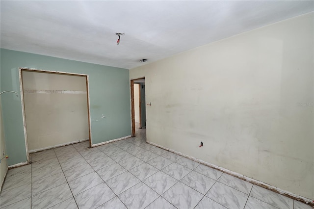 535 Romano Ave, Orlando, FL 32807 - unfurnished bedroom with a closet and baseboards
