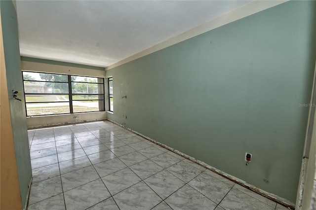 535 Romano Ave, Orlando, FL 32807 - empty room featuring light tile patterned flooring and baseboards