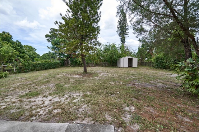 535 Romano Ave, Orlando, FL 32807 - fenced backyard featuring a storage shed