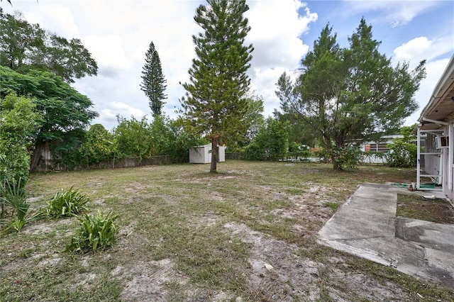 535 Romano Ave, Orlando, FL 32807 - fenced backyard with a storage unit