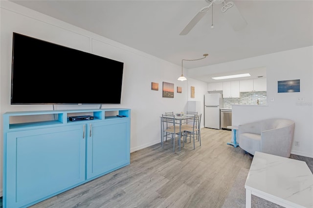 2700 Ocean Shore Blvd Unit 515, Ormond Beach, FL 32176 - living area with light wood-style floors and ceiling fan