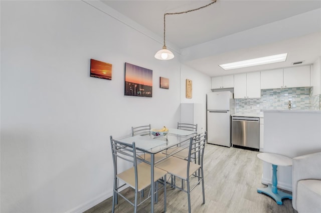 2700 Ocean Shore Blvd Unit 515, Ormond Beach, FL 32176 - dining area featuring light wood-type flooring
