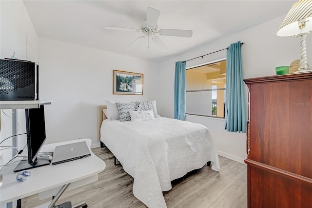 2700 Ocean Shore Blvd Unit 515, Ormond Beach, FL 32176 - bedroom with light wood-type flooring, an office area, and a ceiling fan