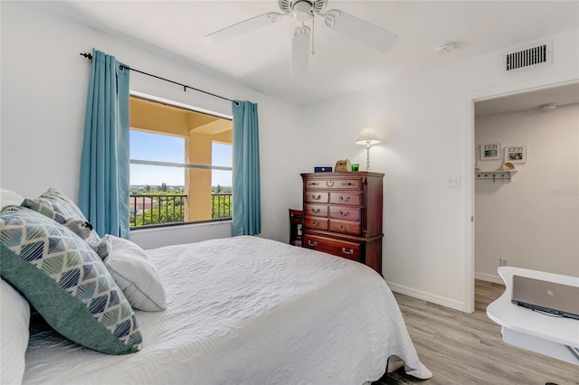 2700 Ocean Shore Blvd Unit 515, Ormond Beach, FL 32176 - bedroom featuring light wood-style floors and ceiling fan